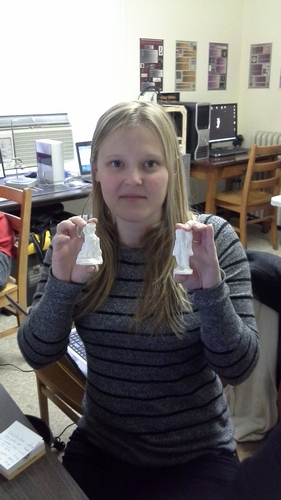 Lauren Volkers holds the printed figurine in her right hand.